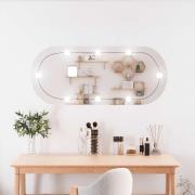 vidaXL Väggspegel med LED-belysning 25x60 cm glas oval